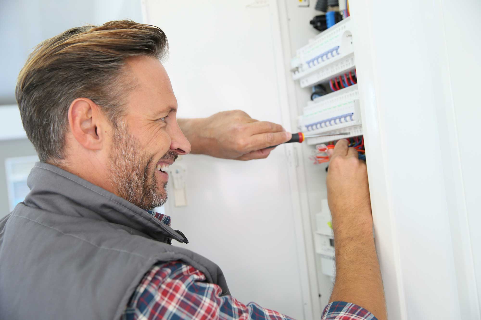 electrician testing a domestic fuseboard