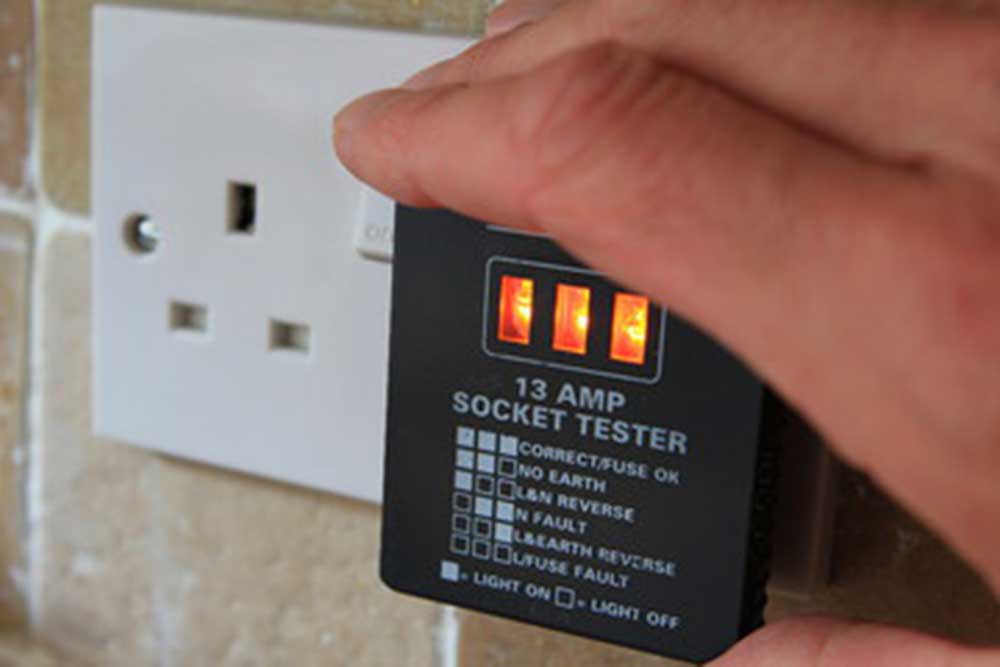 electrician using a socket tester