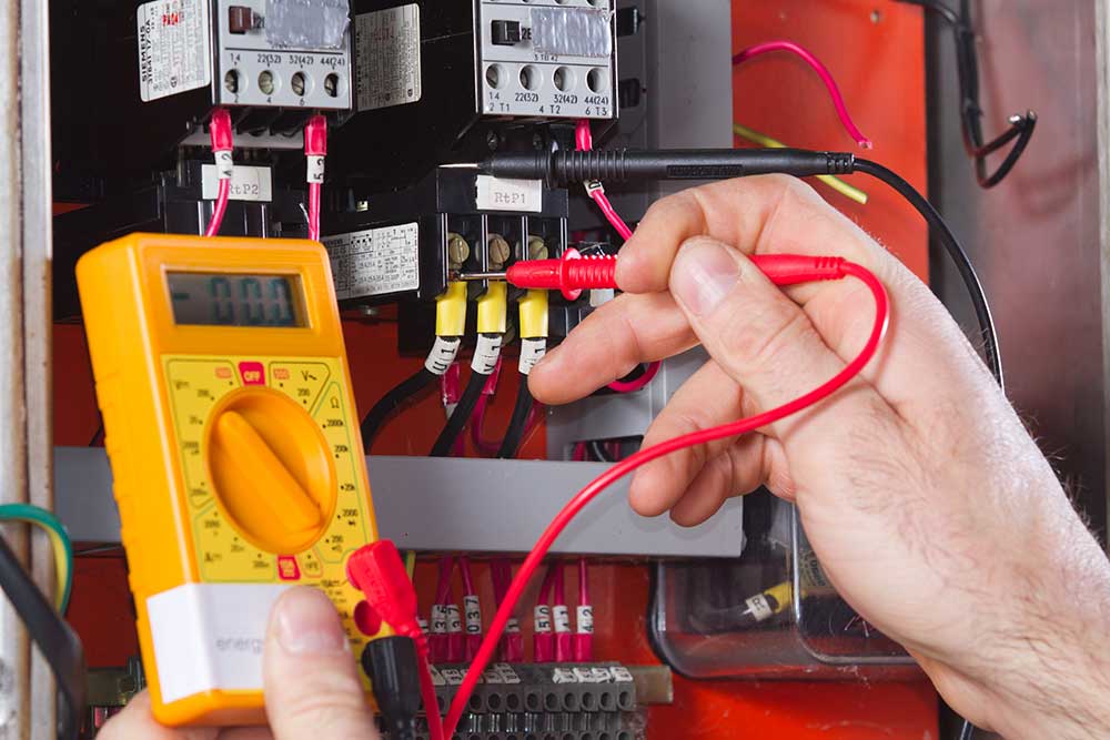 electrician  testing a fuse board